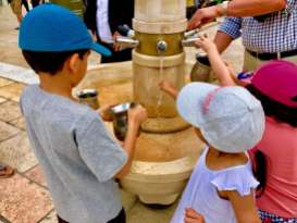 Washing their hands before going to the Wailing Wall...